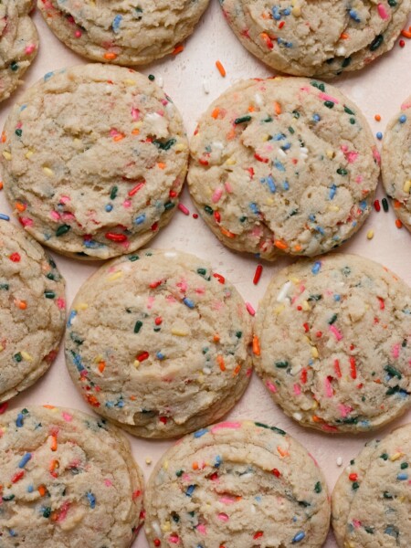 Confetti cookies on a pink backdrop