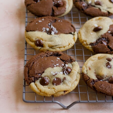 Brookie cookies on a cooling rack on a pink backdrop
