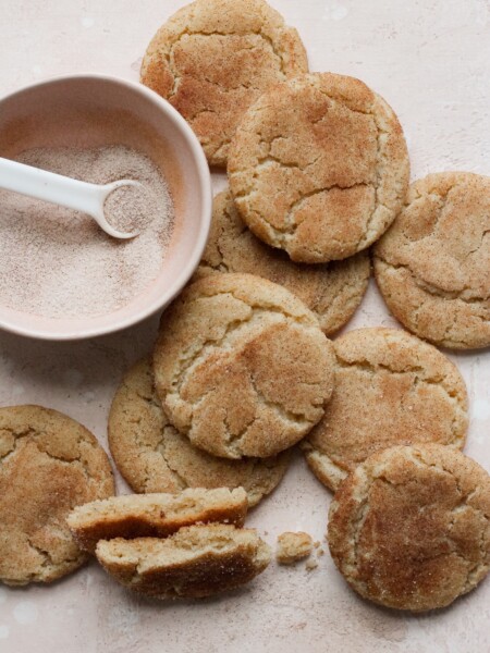 Brown butter snickerdoodles on a pink backdrop