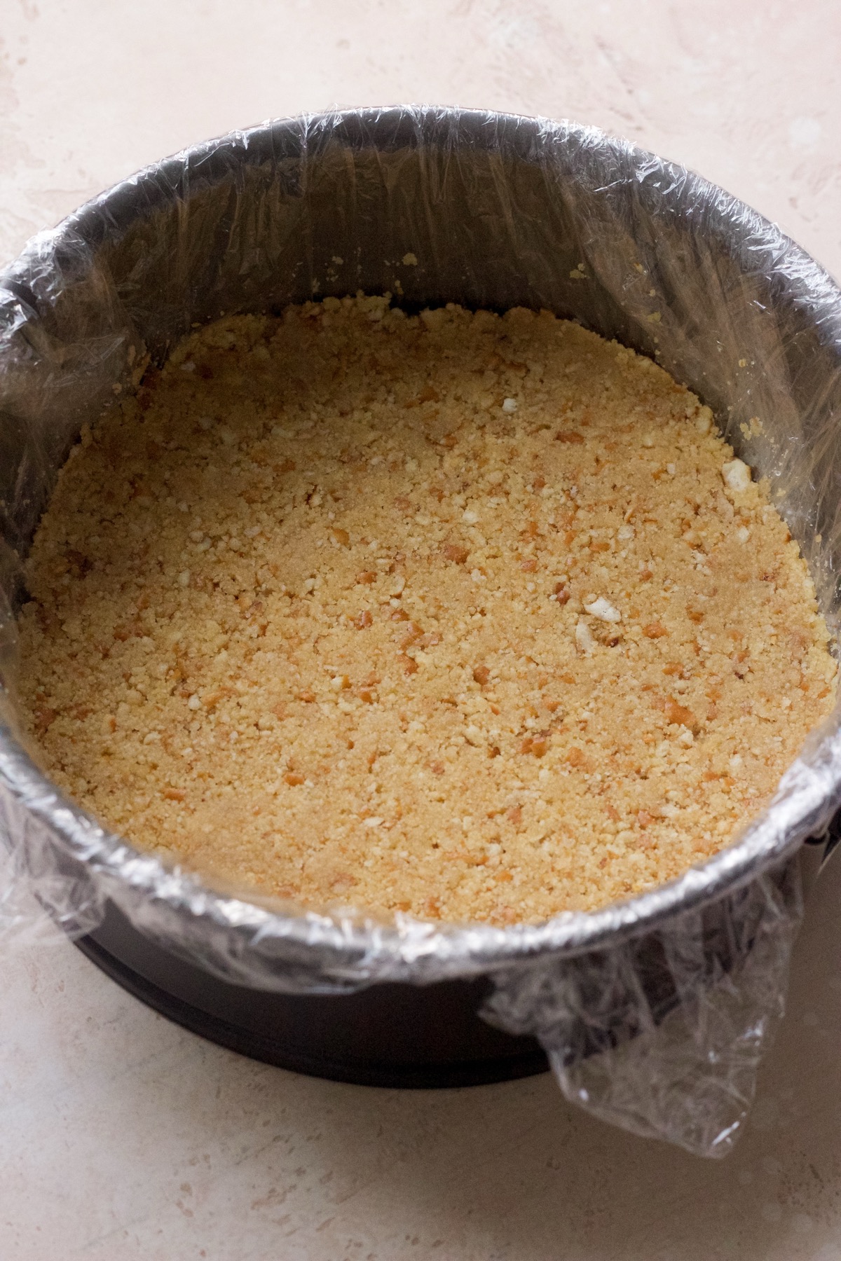 Step by step photo of strawberry crunch ice cream cake