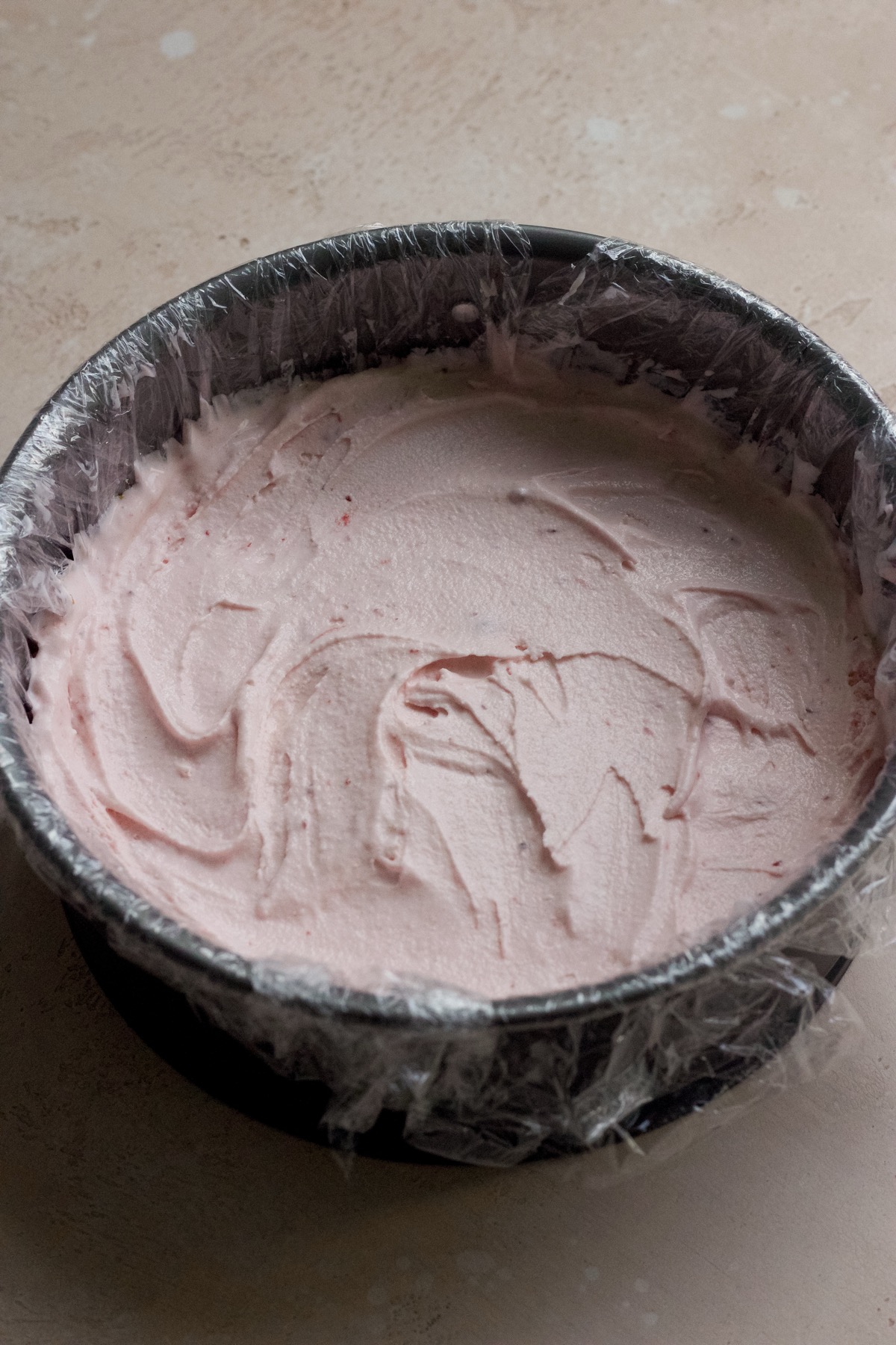 Step by step photo of strawberry crunch ice cream cake