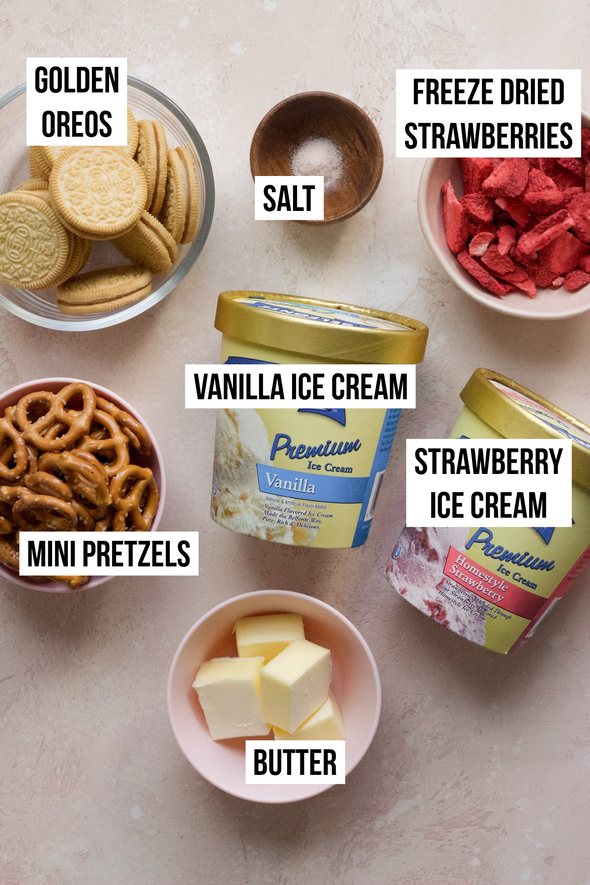 Strawberry crunch ice cream cake ingredients on a backdrop