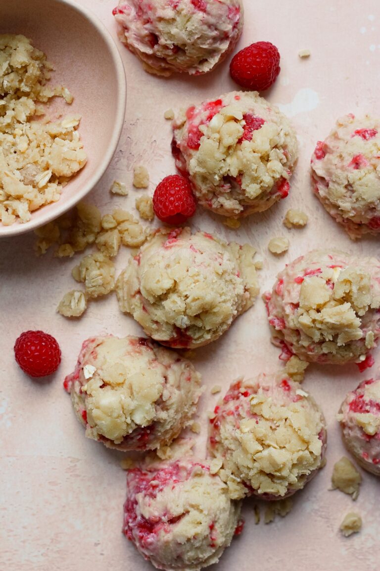 Raspberry muffin cookies on a pink backdrop.