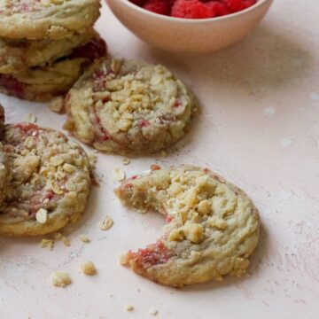 Raspberry muffin cookies on a pink backdrop.