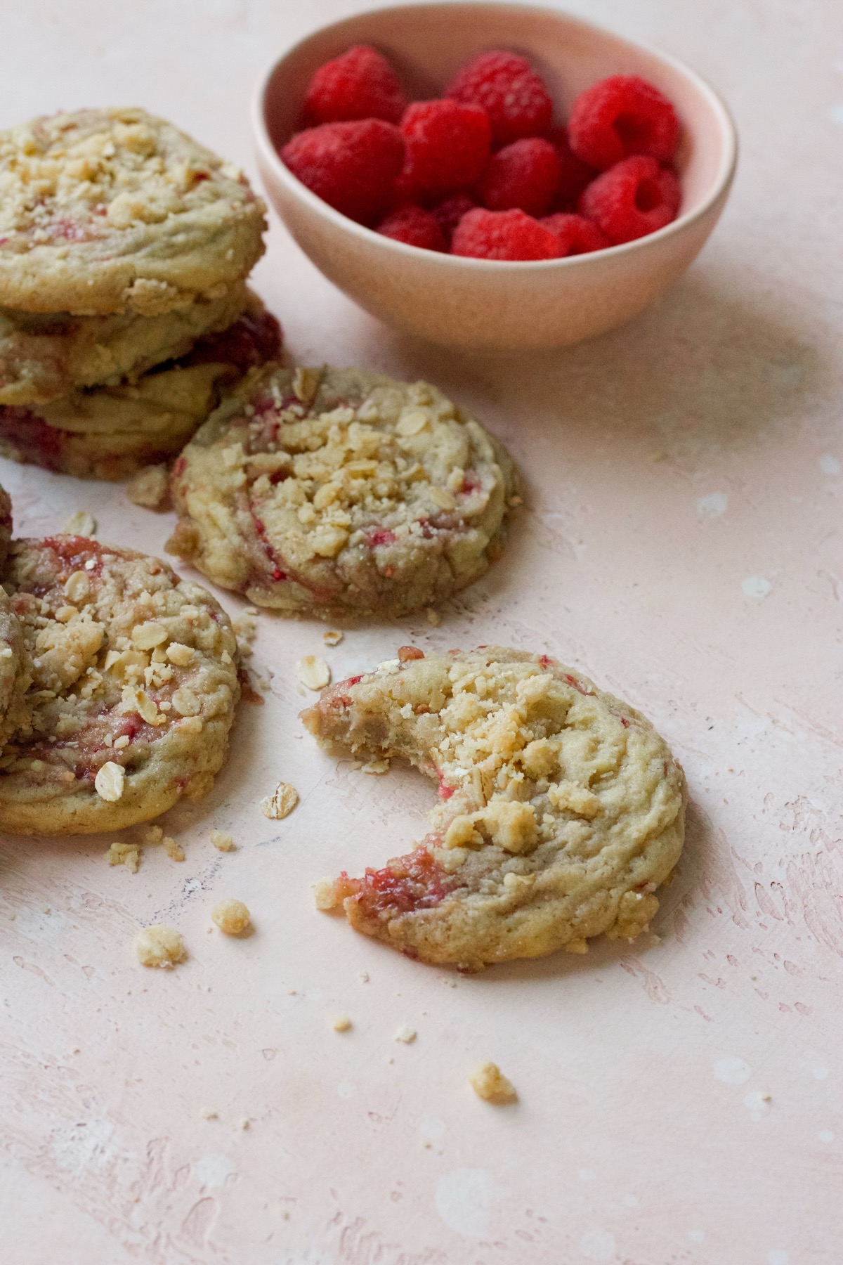 Raspberry muffin cookies on a pink backdrop