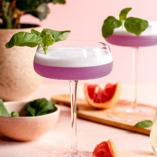 Ruth basil gin-sburg cocktail on a pink backdrop