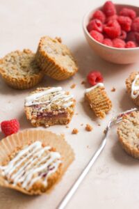 Raspberry cookie cups on a pink backdrop