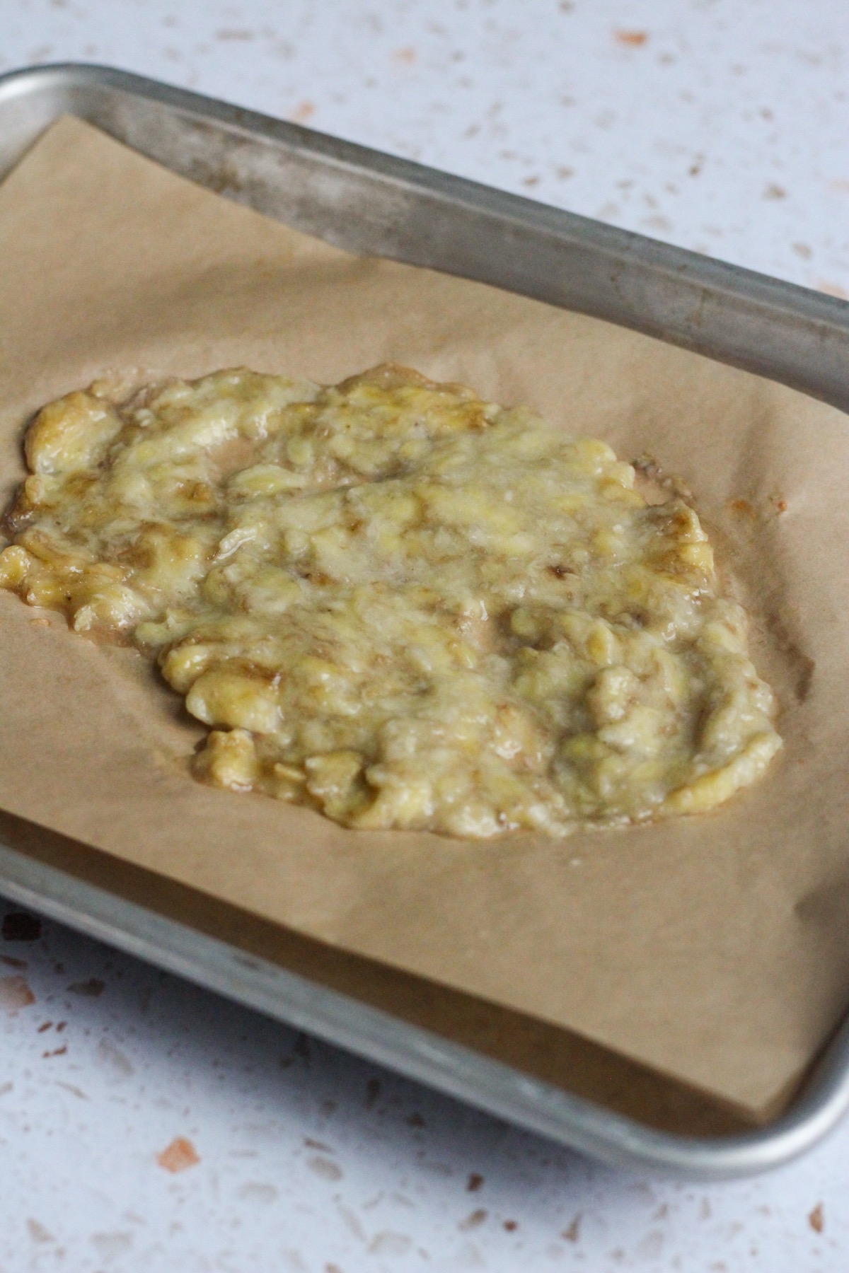 Roasted banana on a baking sheet.