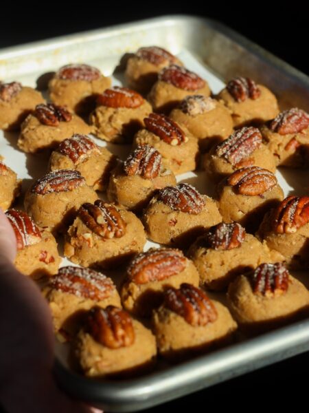 Butter pecan cookie dough on a baking sheet.
