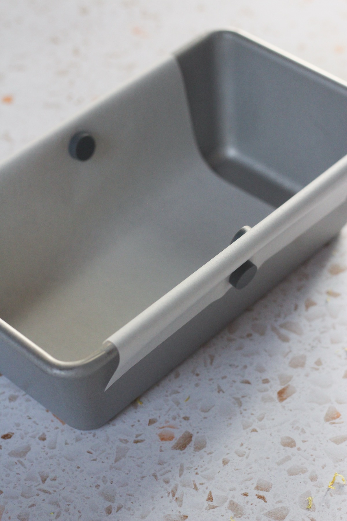 A parchment paper lined 9x5 pan.