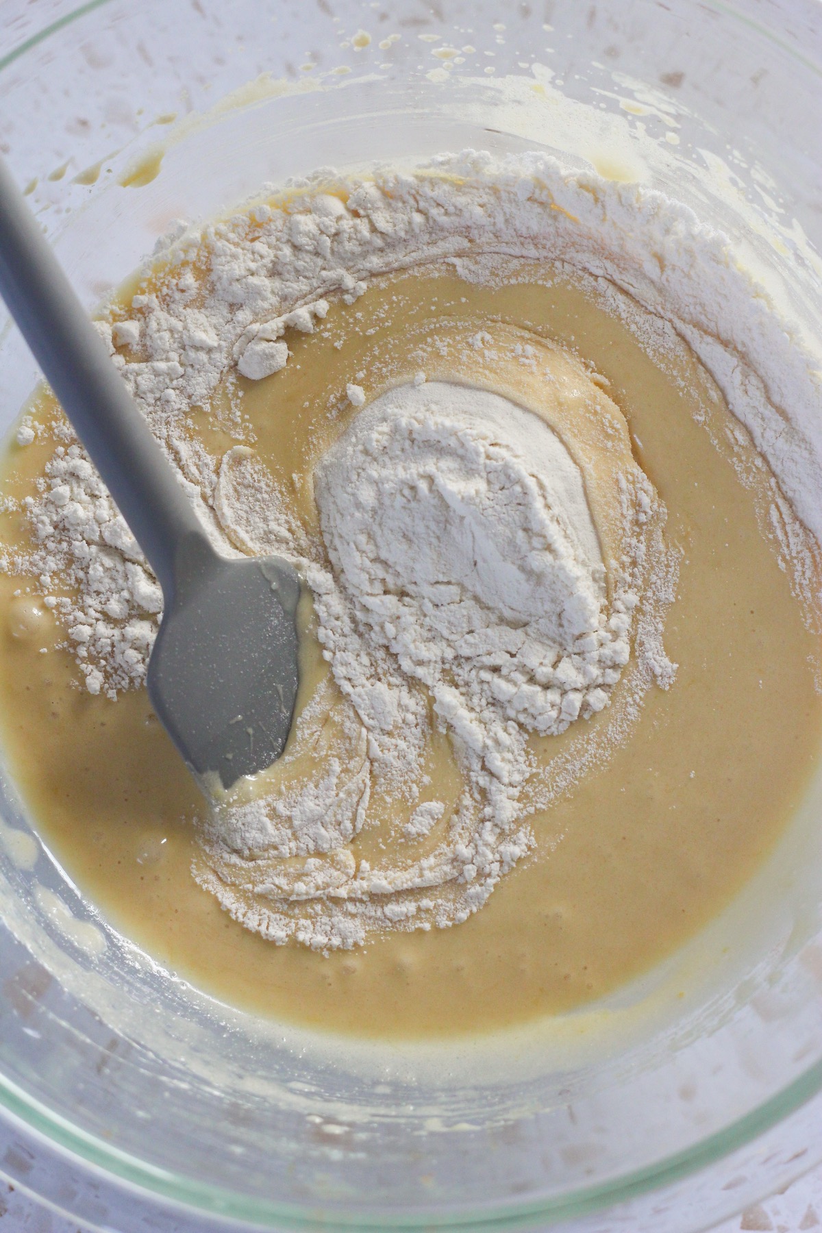 Lemon brownies batter in a glass bowl.