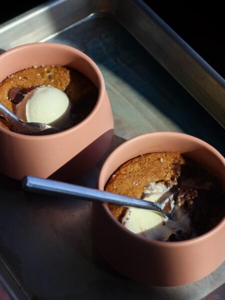 Brookie skillets on a baking sheet.