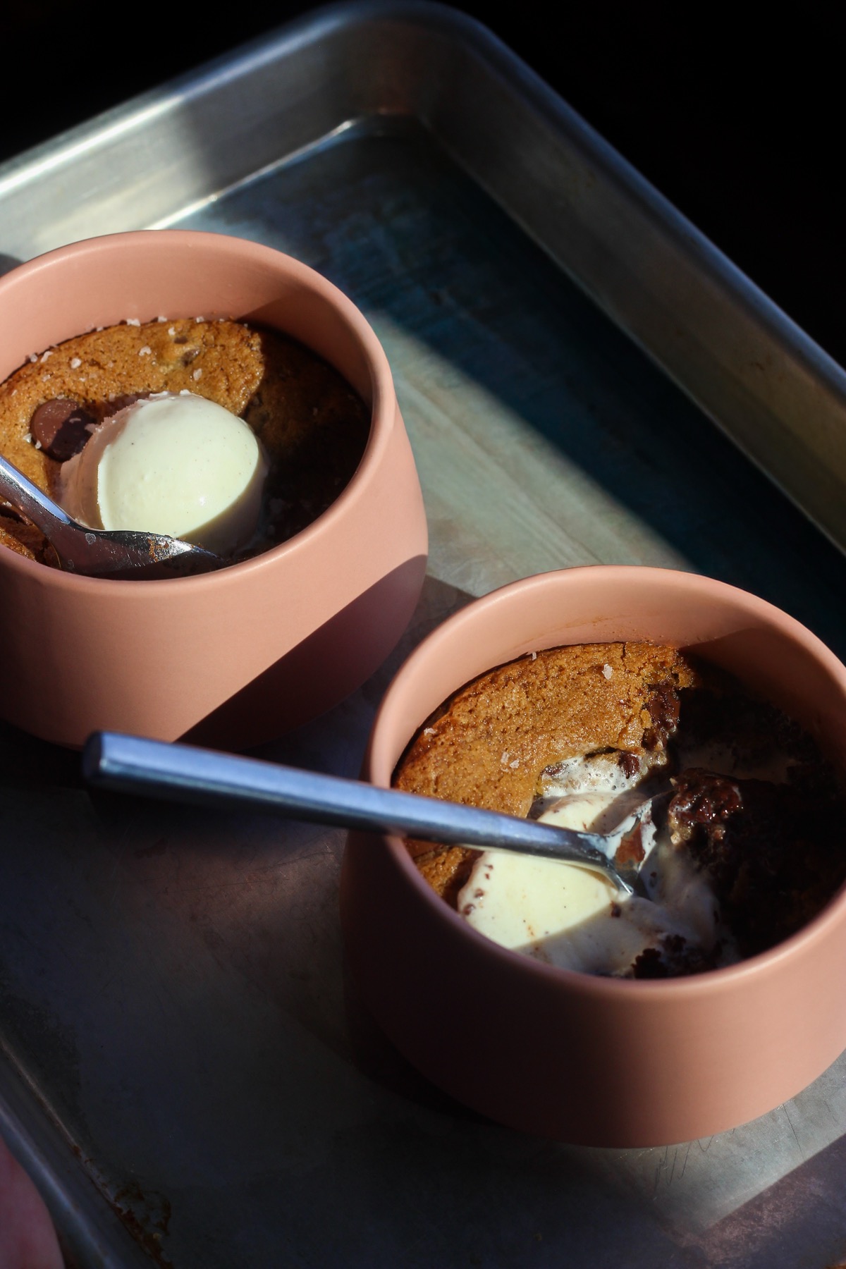 Brookie skillets on a baking sheet.