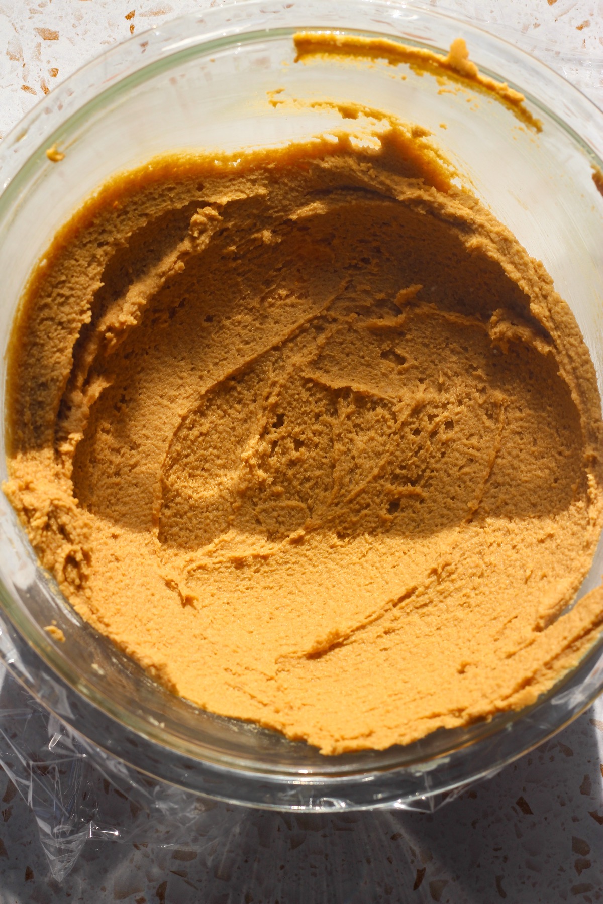 Peanut butter blossom dough in direct sunlight.