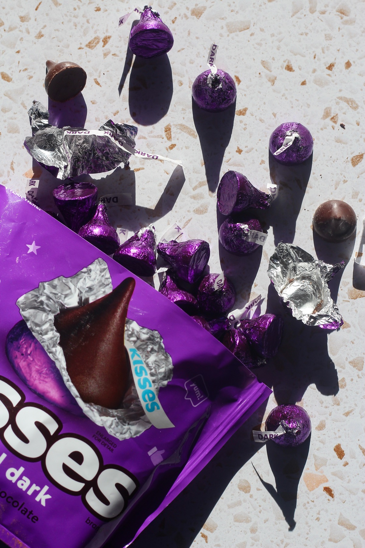 Chocolate kisses being unwrapped.