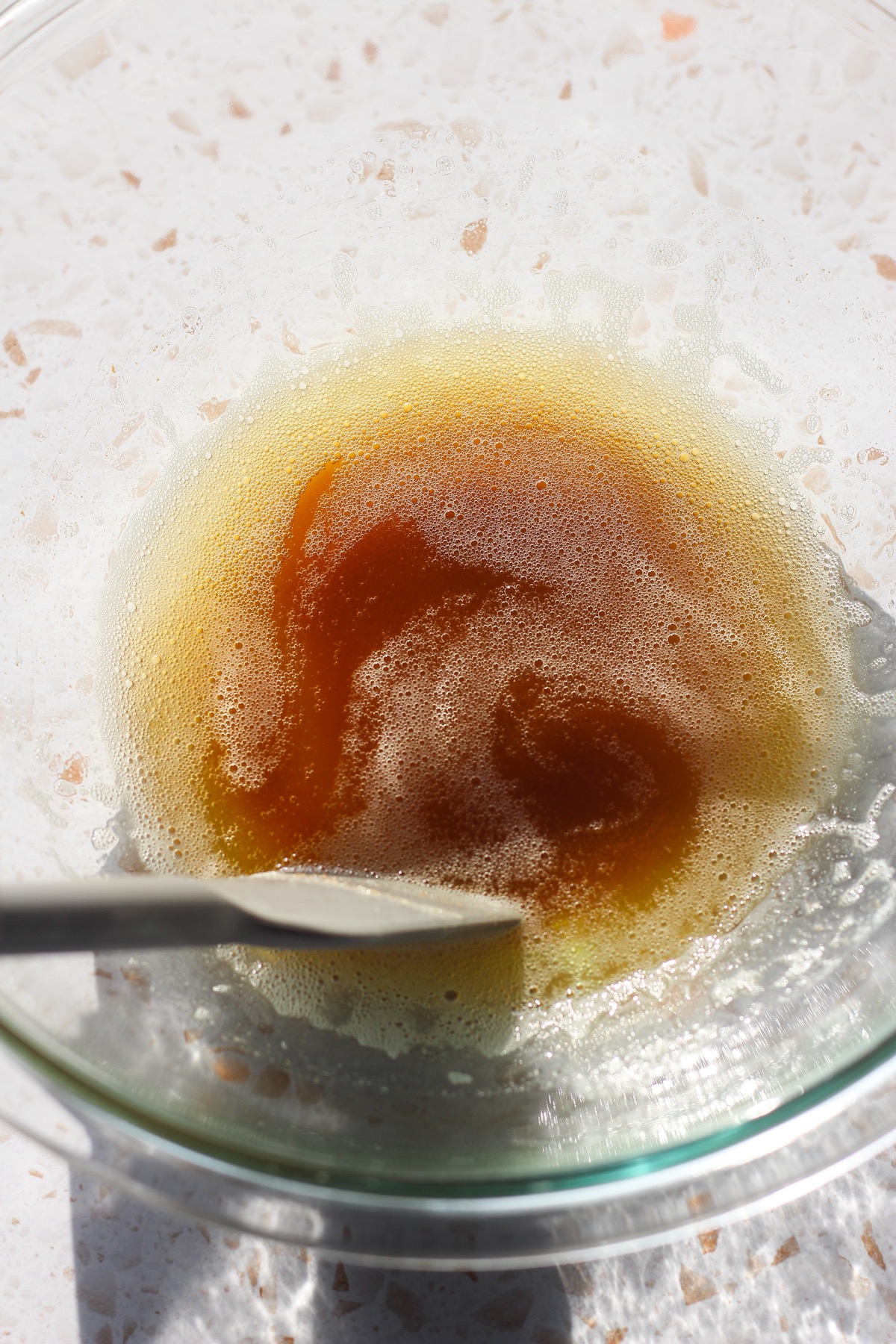 Brown butter in a glass bowl.