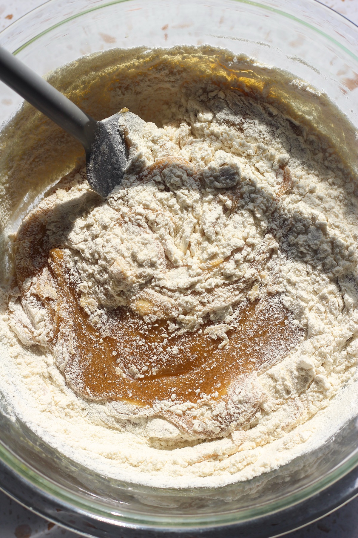 Dry ingredients folding into butter mixture.