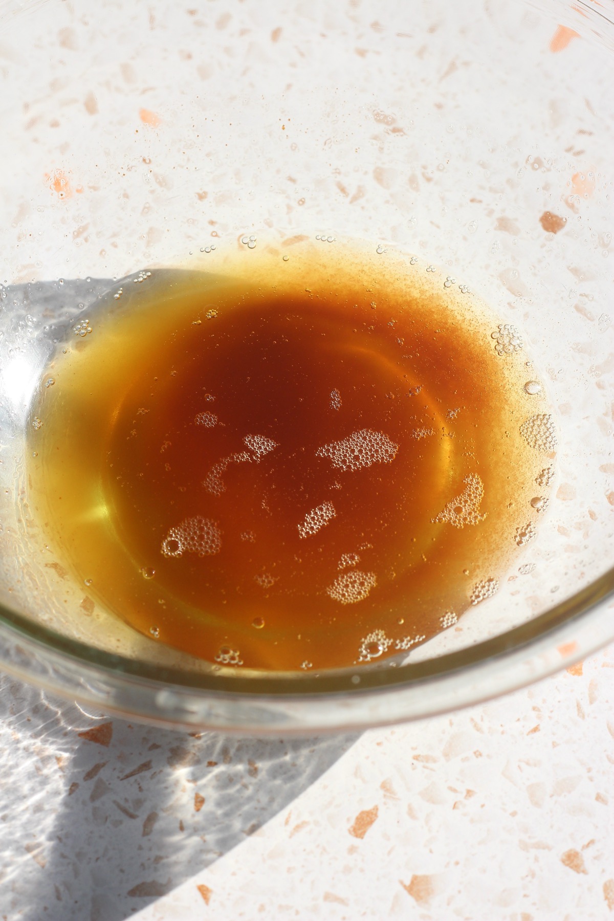 Freshly browned butter in a glass bowl for pumpkin oatmeal cookie dough