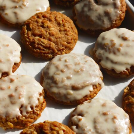 Tray of brown butter pumpkin oatmeal cookies, some with icing and some without