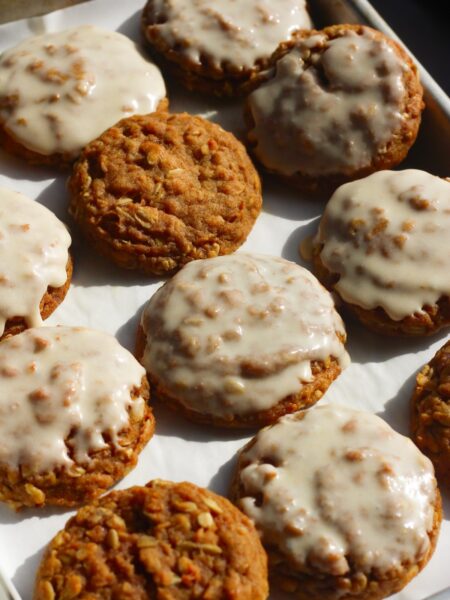 Tray of brown butter pumpkin oatmeal cookies, some with icing and some without