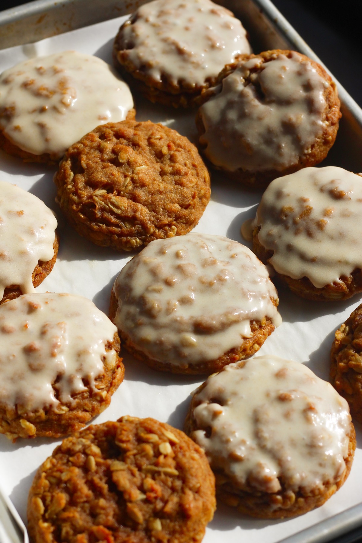 Tray of brown butter pumpkin oatmeal cookies, some with icing and some without